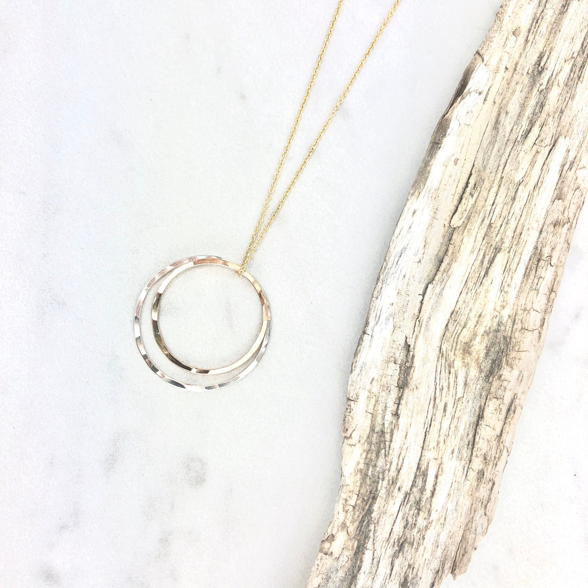 Eclipse Necklace, silver hematite stone ball, gold half circle