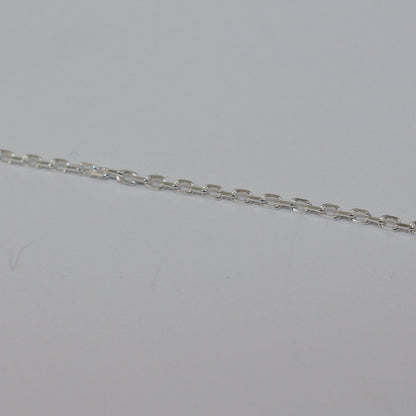 Silver chain on a light gray background