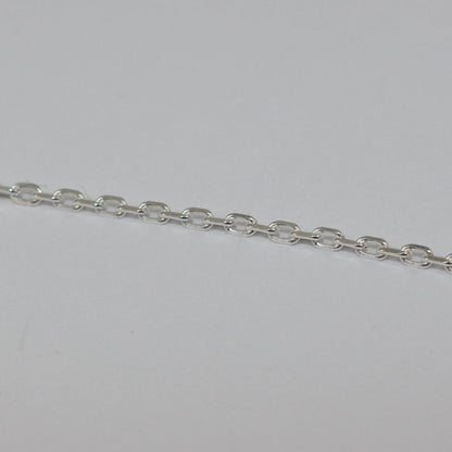 Silver chain on a light gray background