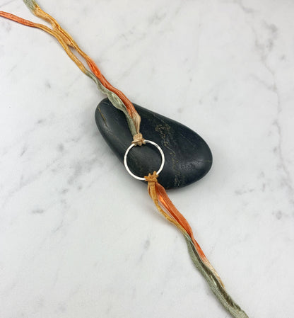 Sterling Silver Karma Bracelet, orange/gray silk, friendship bracelet, eternity ring, silver circle bracelet, dainty bracelet, hoop bracelet
